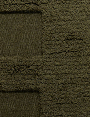 Raita subtle bar patter fringe area rug in moss green