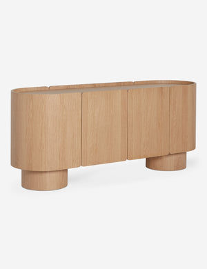 Angled view of the Raphael modern rounded honey oak sideboard cabinet