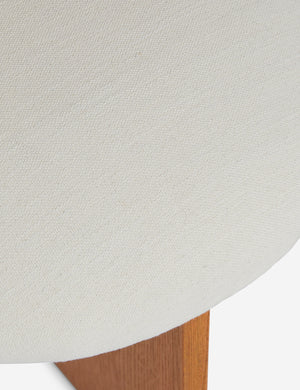 Close up view of the Ripple tall, wavy back wooden dining chair upholstered seat