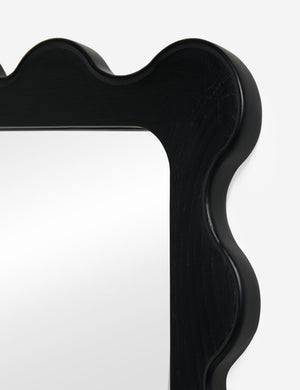 Close up view of the  Ripple wavy framed full length mirror in black oak