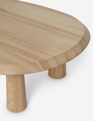 Close up angled view of Rodolfo organic oval natural wood coffee table