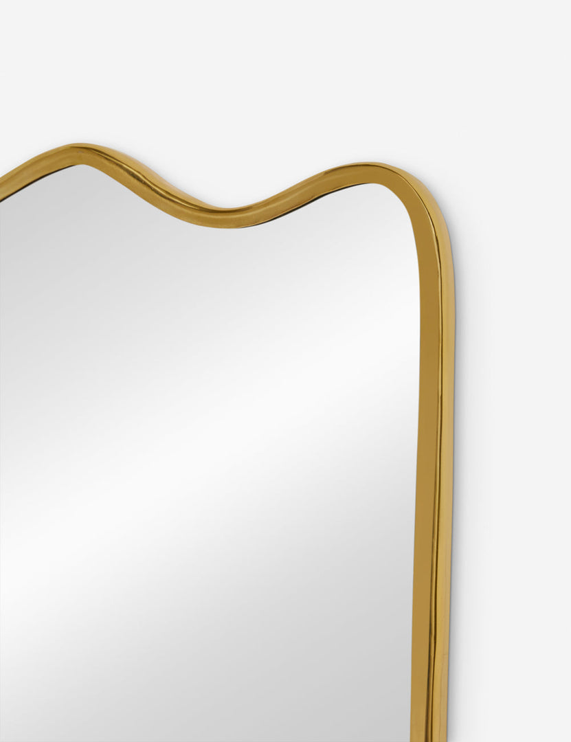 #color::gold | The top corner of the rook mantel mirror
