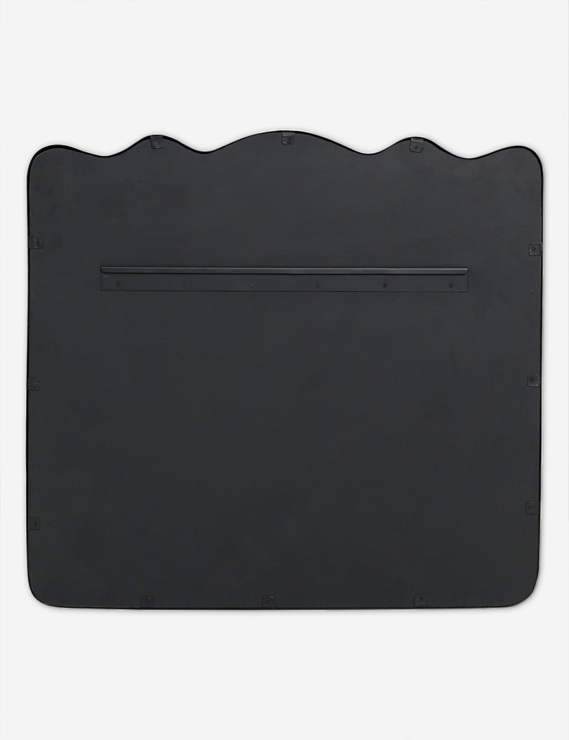 #color::black | Back of the Rook wavy slim frame mantel mirror in charcoal