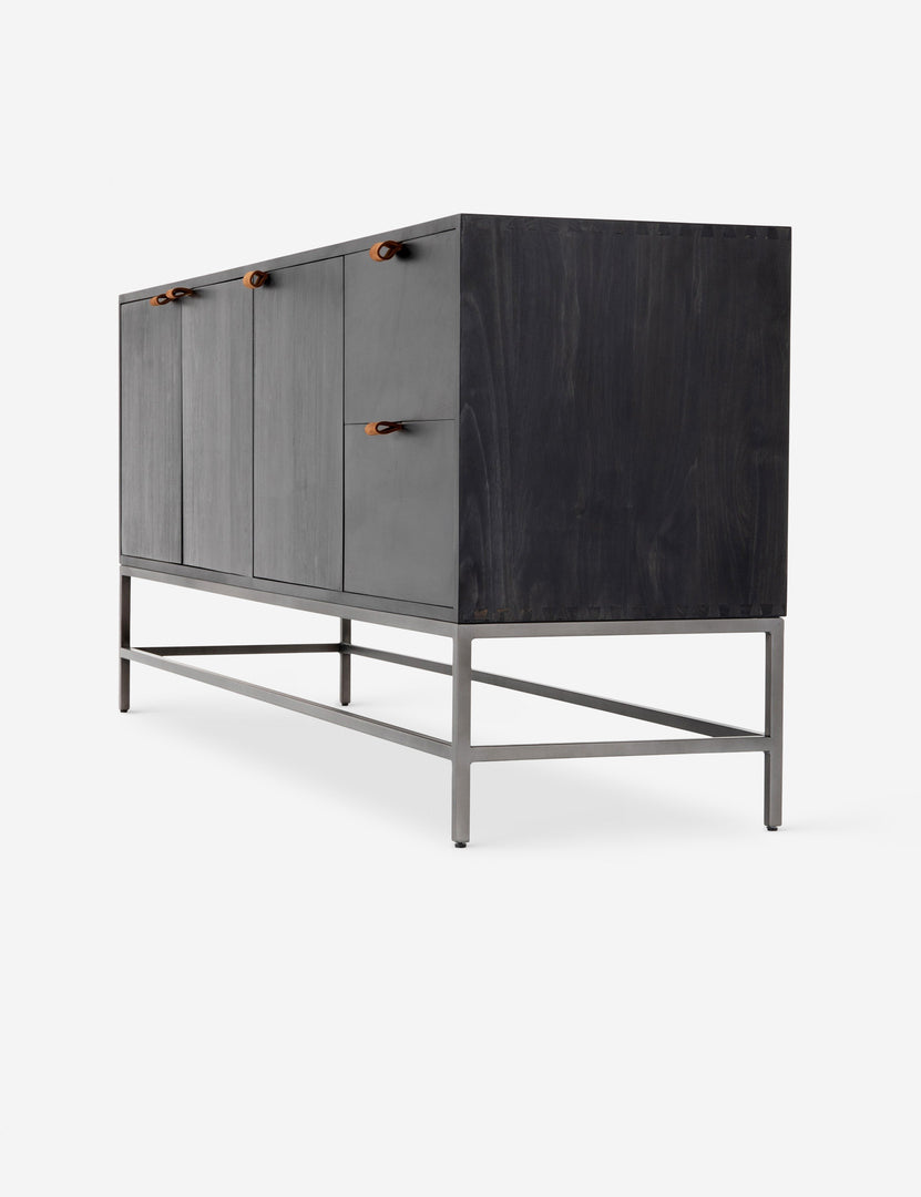 #color::black | Right side view of the Rosamonde black wood sideboard with brown leather pulls and a metal base