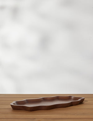 Angled view of the Ruffle walnut wood Serving Tray by Sarah Sherman Samuel