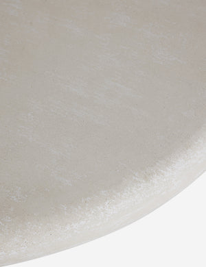 Close up of the Ruiz round cement outdoor coffee table.