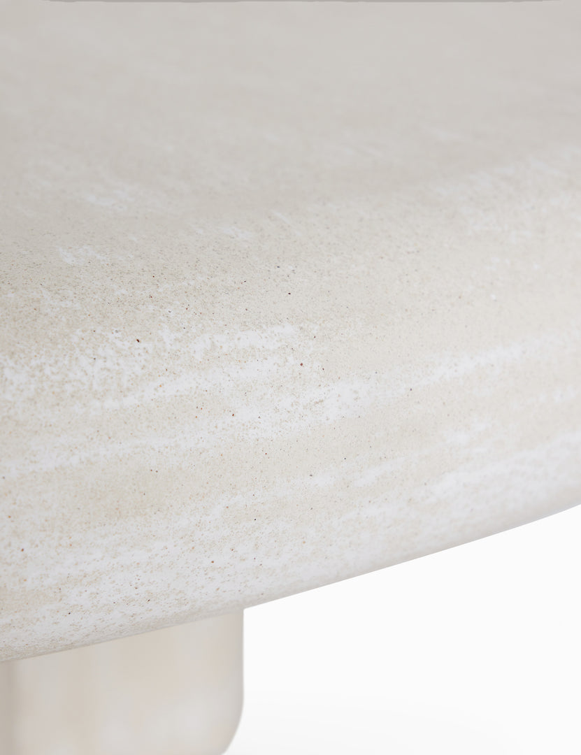 #color::ivory | Close up of the Ruiz round cement outdoor coffee table.
