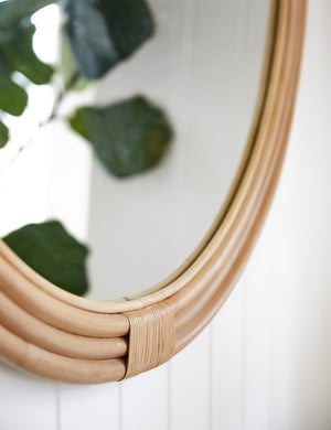 Close up view of the Marsali rattan framed round mirror