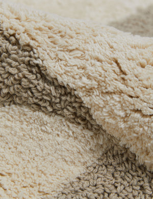 Close up view of the Sandoval neutral modern bath mat