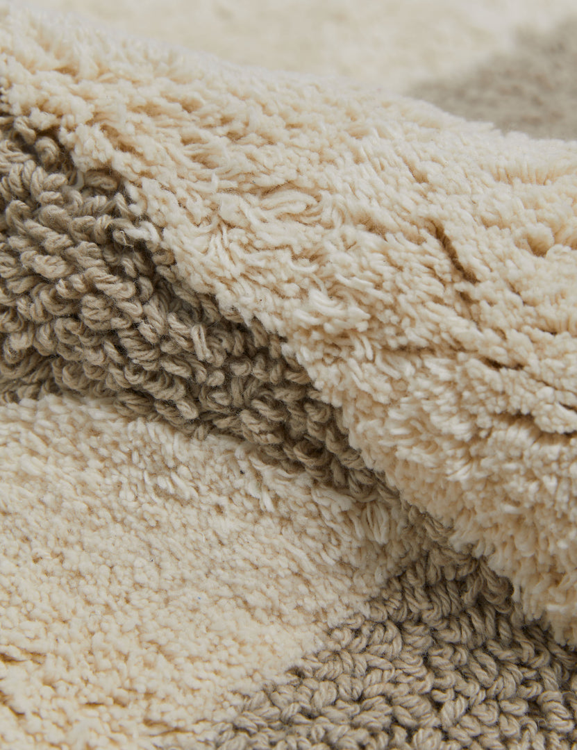 #size::21--x-34- #size::2--x-5- | Close up view of the Sandoval neutral modern bath mat