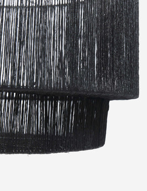 Detailed shot of the black jute on the side of the Sayan black jute-wrapped pendant light