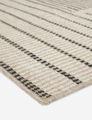 Close up of the Shere handwoven striped outdoor rug by Sarah Sherman Samuel in Natural