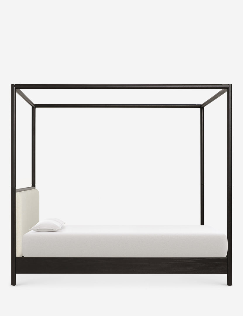 #color::black #size::king #size::queen | Side view of Simonette black canopy bed with upholstered headboard