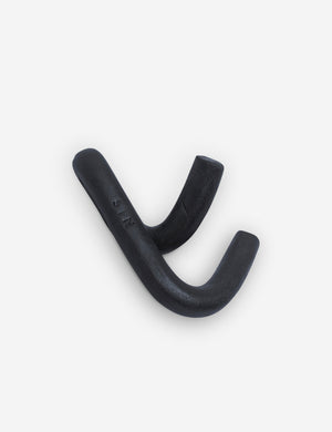 Angled view of the Black Leggy Crossed Wall Hook by SIN Ceramics