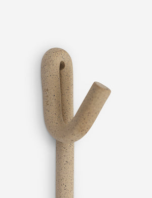 Close-up of the Cream speckled pattern on the Leggy Long Wall Hook by SIN Ceramics
