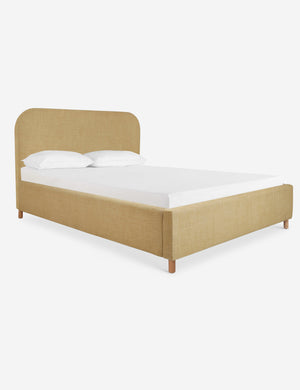 Angled view of the Solene Wheat yellow linen platform bed
