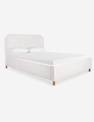 Angled view of the Solene White linen platform bed