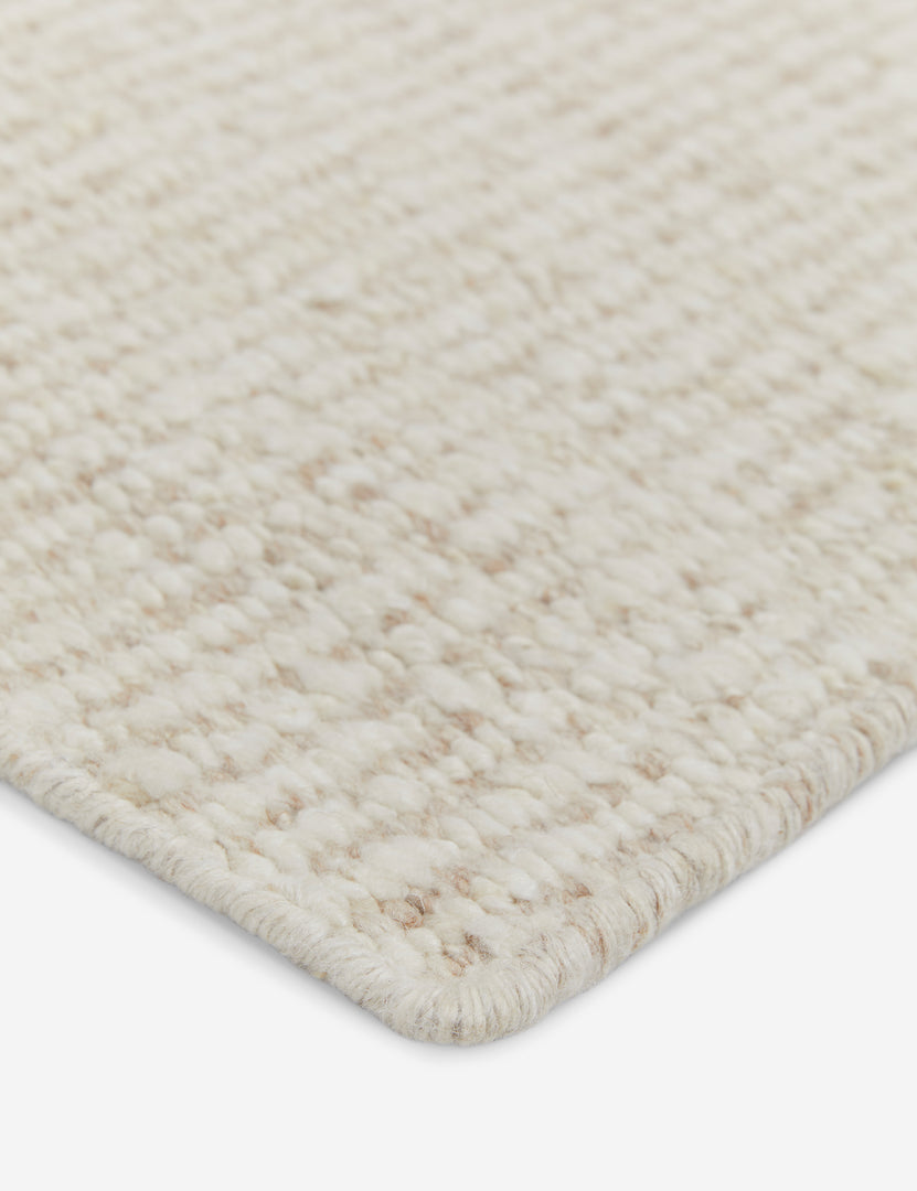 #color::ivory #size::10--x-14- #size::2-6--x-8- #size::6--x-9- #size::8--x-10- #size::9--x-12- #size::12--x-15- | The corner of the Taos ivory rug