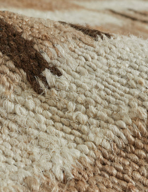 Close up view of the texture of the Tempo Flatweave Jute Rug by Elan Byrd.