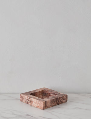 Angled view of the Teo catchall square tray in pink marble