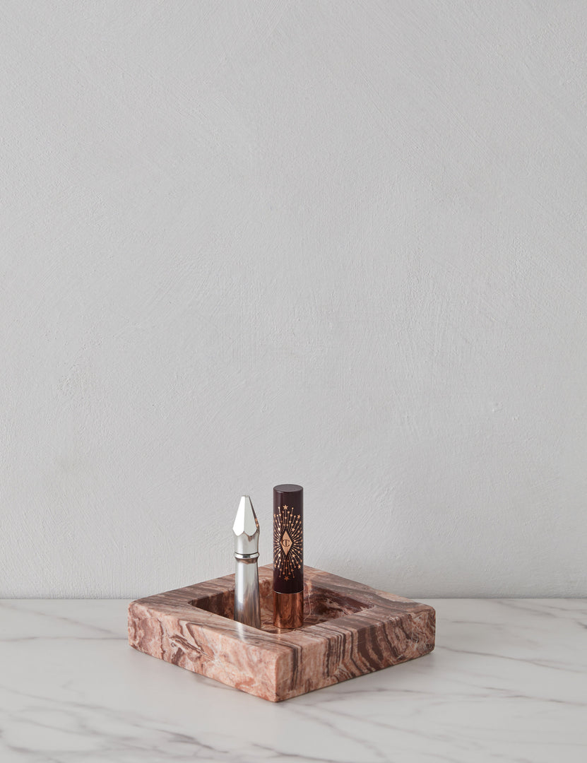#color::pink-puff-marble | Teo catchall square tray in pink marble holding lipsticks
