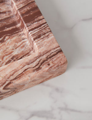 Close up view of the Teo catchall square tray in pink marble