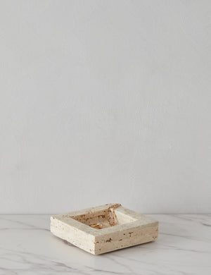 Angled view of the Teo catchall square tray in travertine