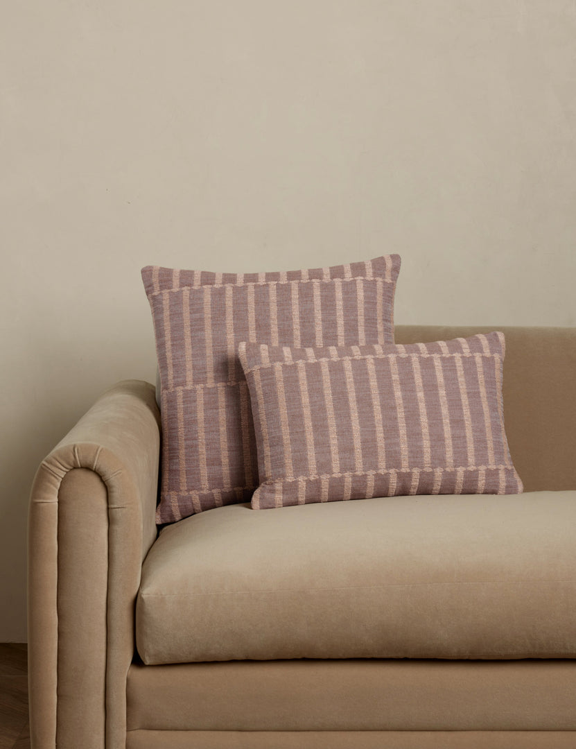 #color::blush #style::square #style::lumbar | Thisbe offset stripe throw and lumbar pillows paired together on a sofa.