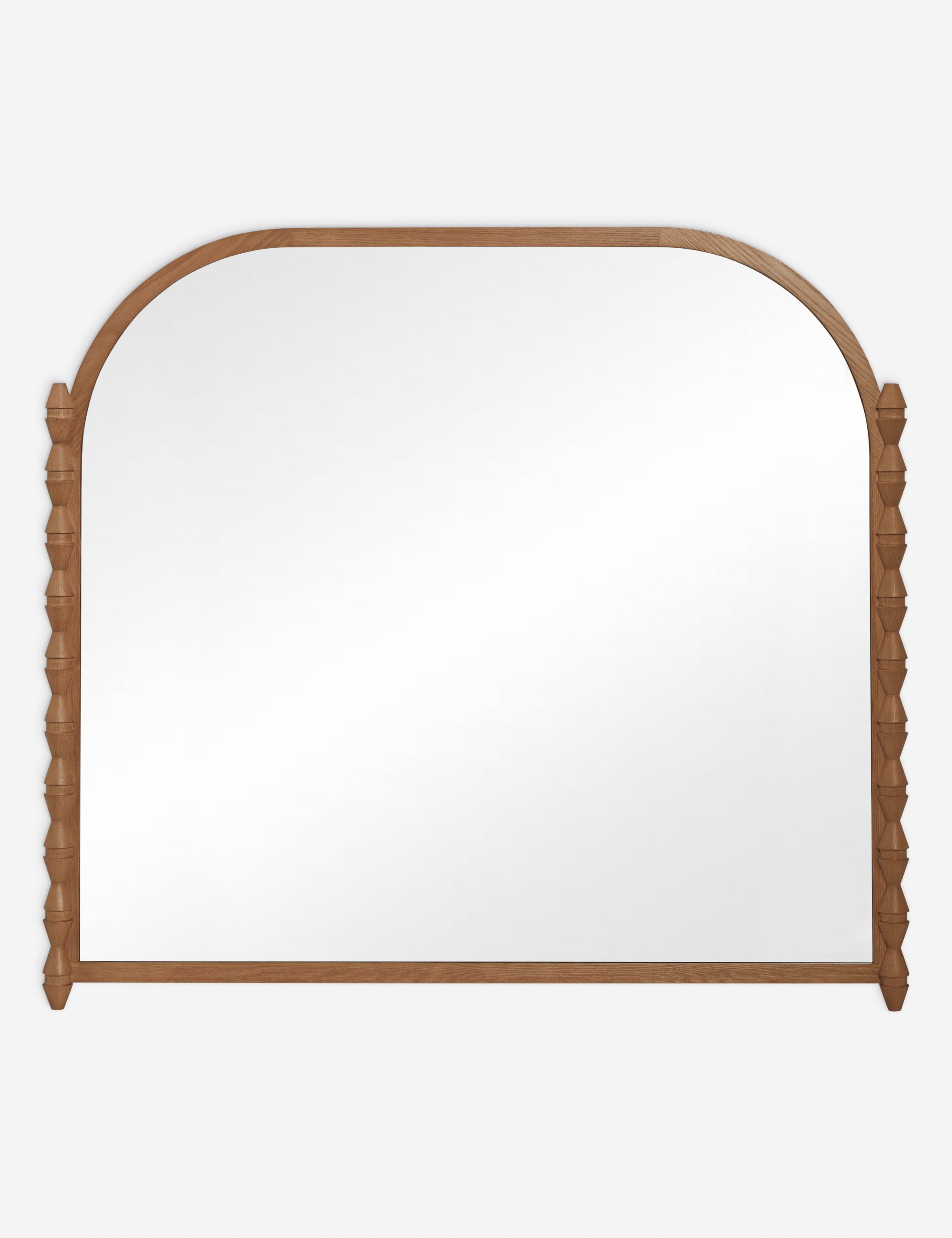 #color::natural | Topia arched carved wood mantel mirror by Ginny Macdonald in natural.