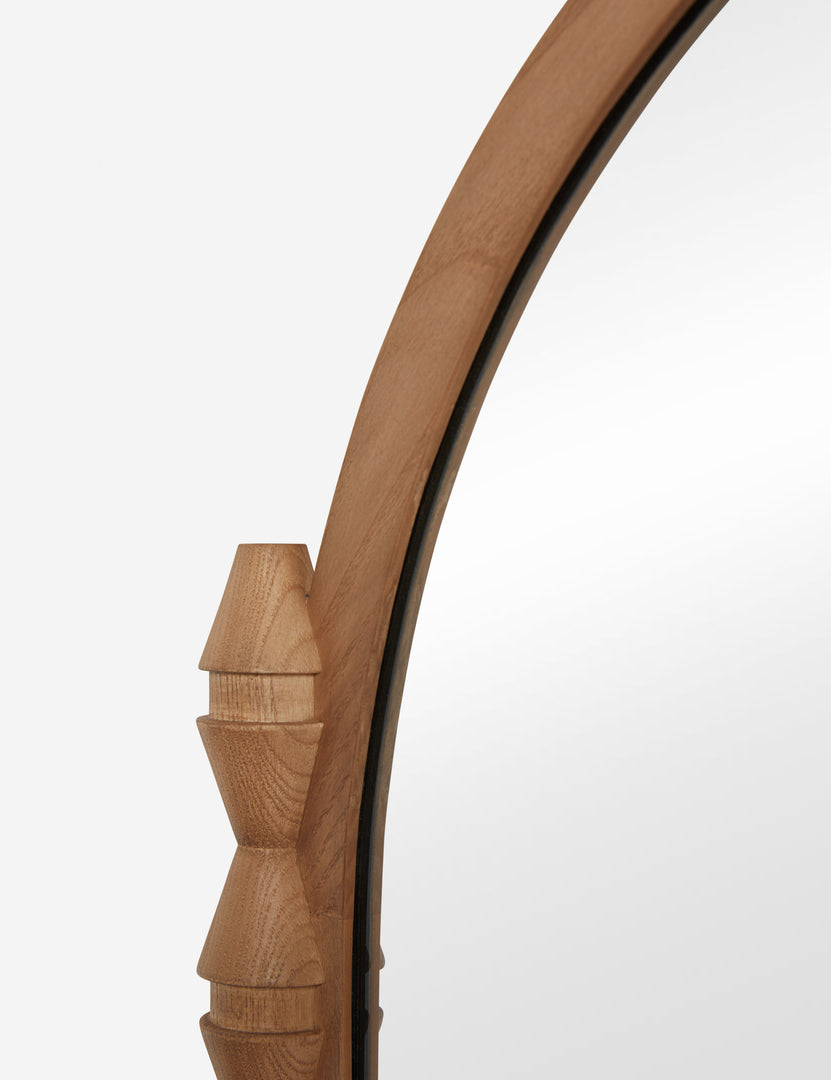 #color::natural | Close up of the Topia arched carved wood mantel mirror by Ginny Macdonald in natural.