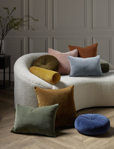  #color::ice-blue #style::lumbar | Charlotte velvet pillow in moss, rosewater, ice blue, burnt orange, and toast sit next to and on a cream boucle lounger