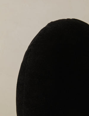 Close up view of the Velvet round accent pillow in black