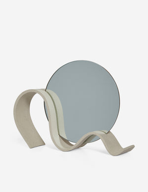 Angled view of the round Wavee Table Mirror by SIN Ceramics