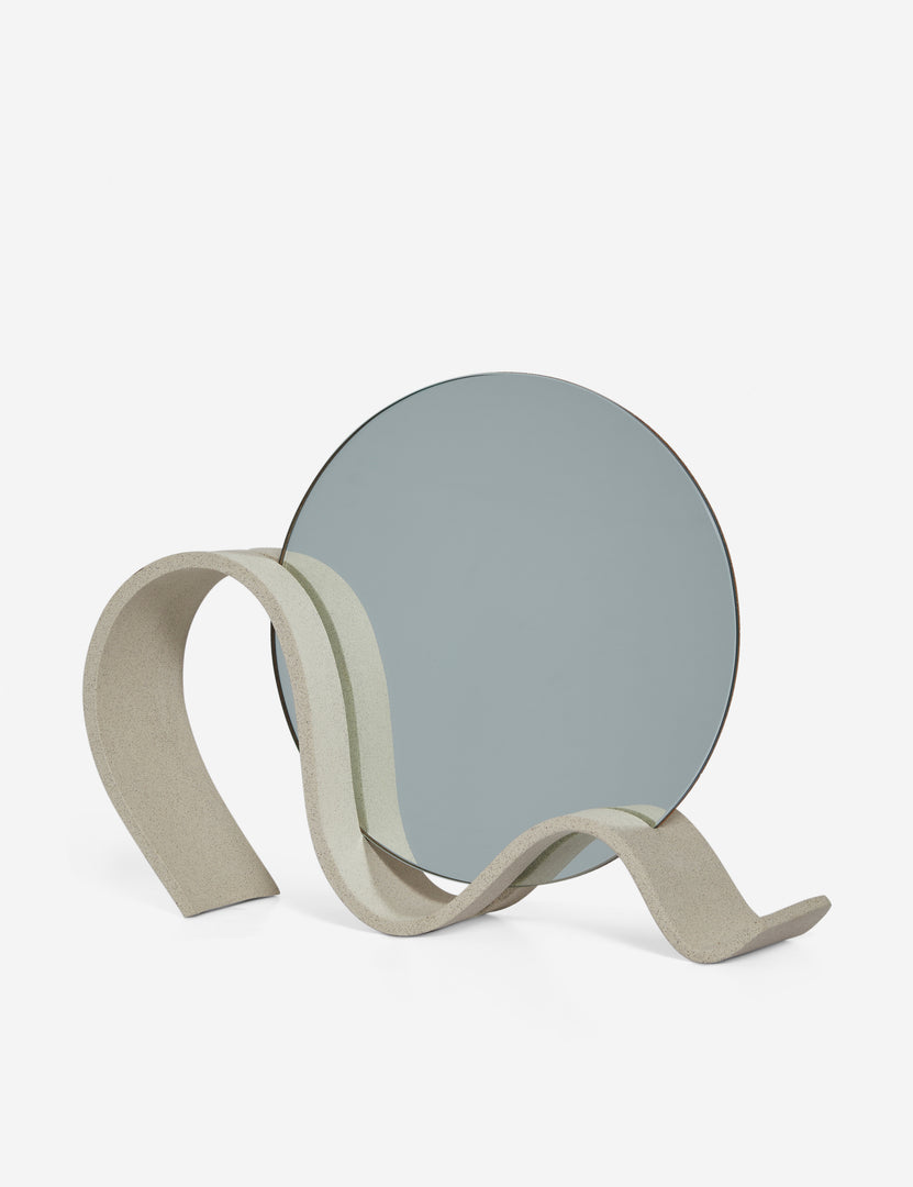 #color::speckled | Angled view of the round Wavee Table Mirror by SIN Ceramics