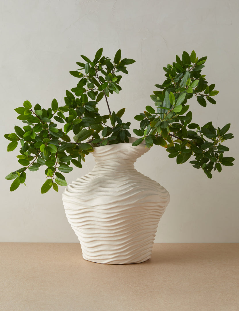 #color::ivory | Wrinkle sculptural, textured glazed vase in ivory filled with greenery stems