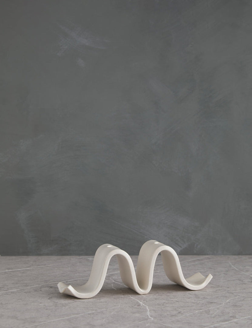 | Wyn White Candelabra by SIN with an undulating silhouette and space for two taper candles