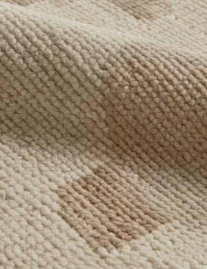 Close up of the Yana hand-knotted organic pattern wool rug.
