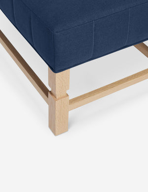 The vertical channeling on the cushion of the Ambleside Dark Blue linen bench