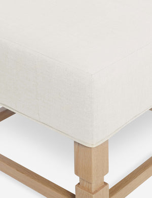 Close-up of the corner on the cushion of the Ambleside Oyster white ottoman