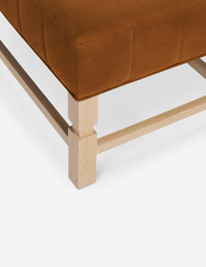 The vertical channeling on the cushion of the Ambleside Cognac velvet bench
