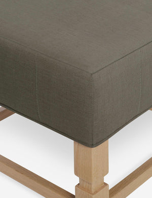 Close-up of the corner on the cushion of the Ambleside Loden gray linen ottoman