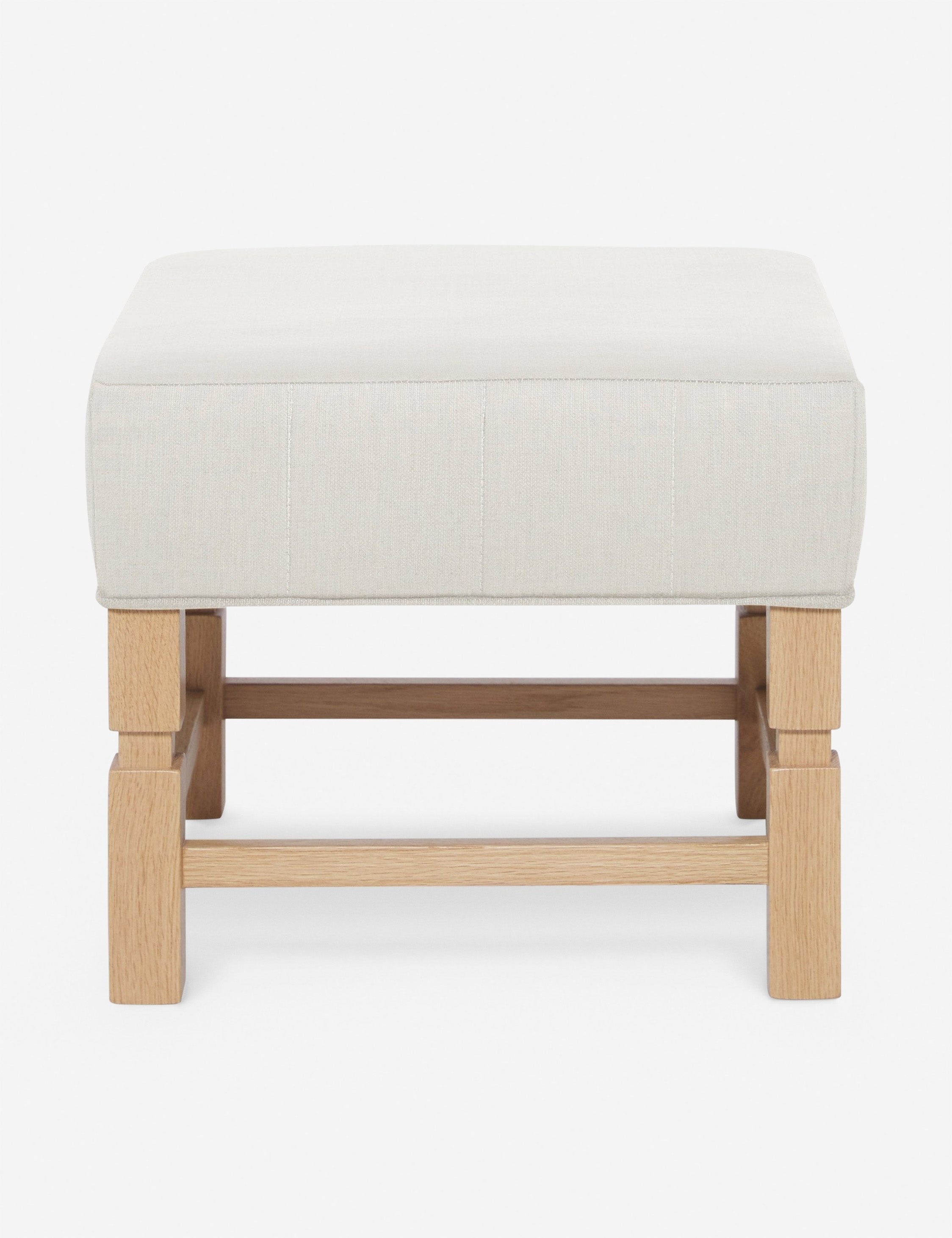 #color::natural | Ambleside Natural linen upholstered ottoman by Ginny Macdonald with a carved frame and vertical channeling on the cushion