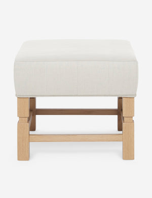 Ambleside Natural linen upholstered ottoman by Ginny Macdonald with a carved frame and vertical channeling on the cushion
