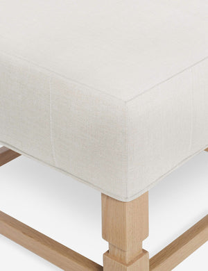 Close-up of the corner on the cushion of the Ambleside Natural linen ottoman