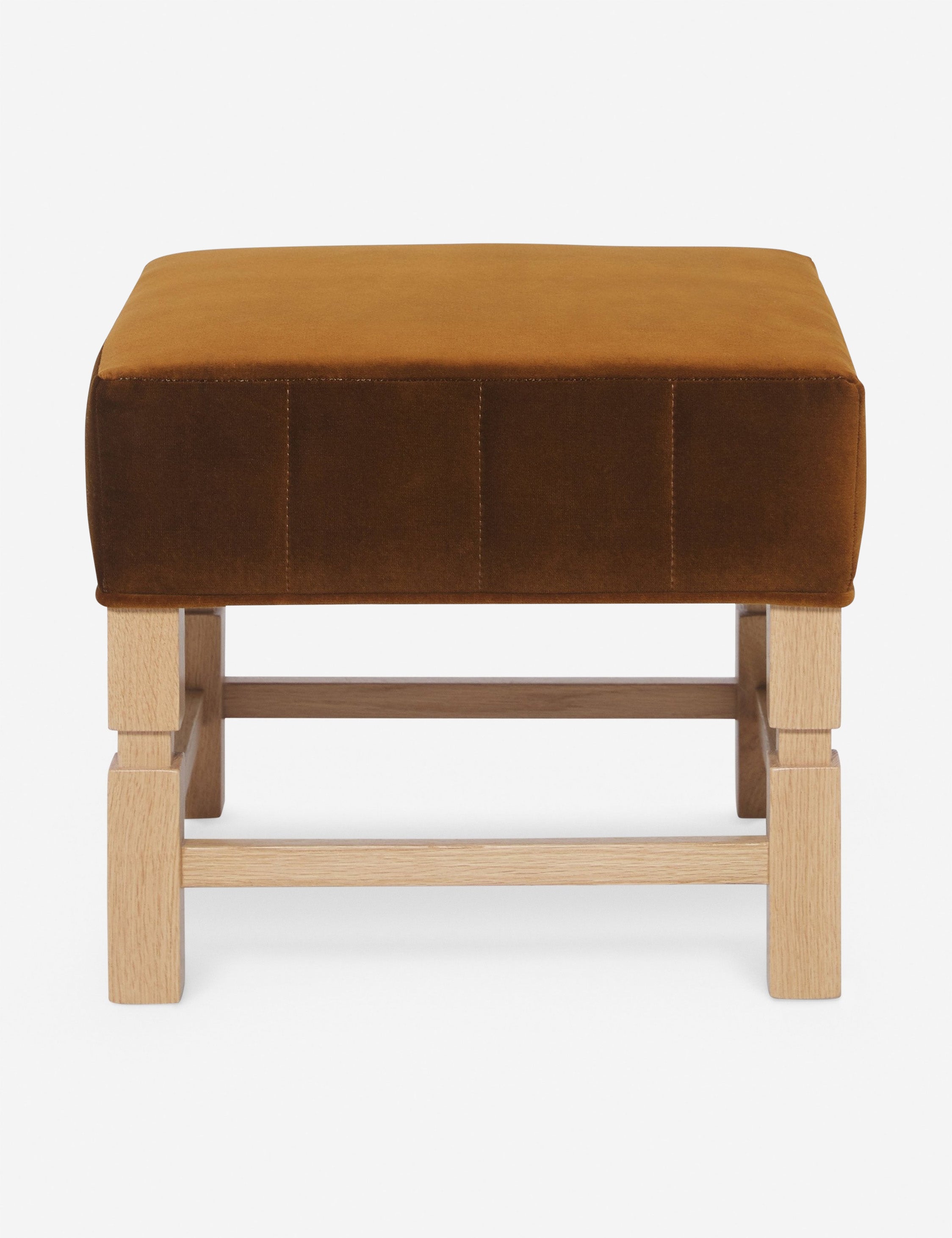 #color::cognac | Ambleside cognac velvet upholstered ottoman by Ginny Macdonald with a carved frame and vertical channeling on the cushion 
