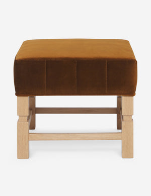 Ambleside cognac velvet upholstered ottoman by Ginny Macdonald with a carved frame and vertical channeling on the cushion