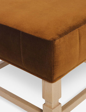 Close-up of the corner on the cushion of the Ambleside cognac velvet ottoman
