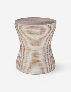 Fenne round ribbed stone side table.
