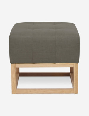 Loden Gray Linen Grasmere Ottoman with an upholstered cushion and airy wooden frame by Ginny Macdonald