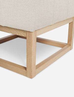 Close up of the airy wooden frame on the bottom of the Grasmere Natural Linen Ottoman